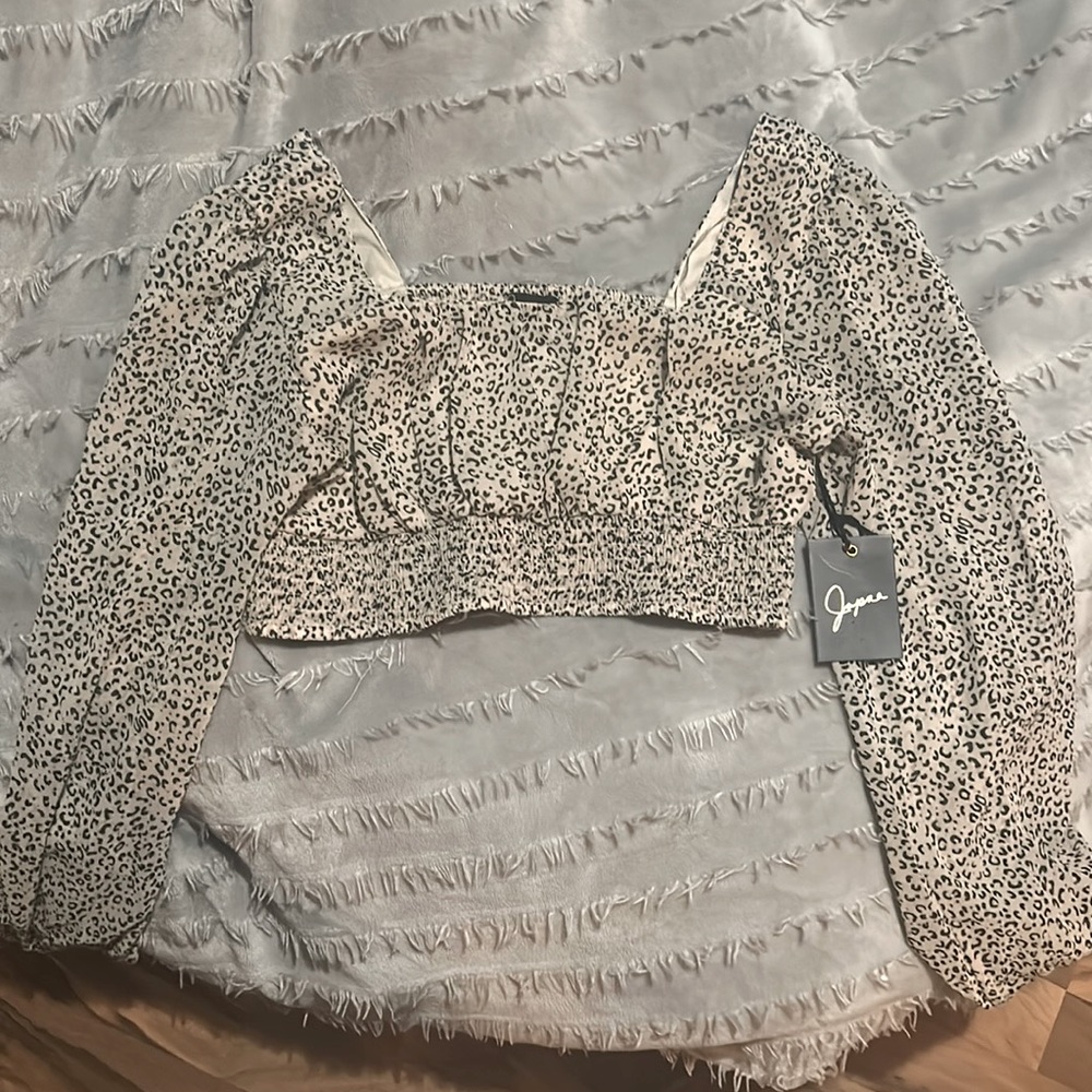A cute little top!! Got at TJ Max still has tags on it.